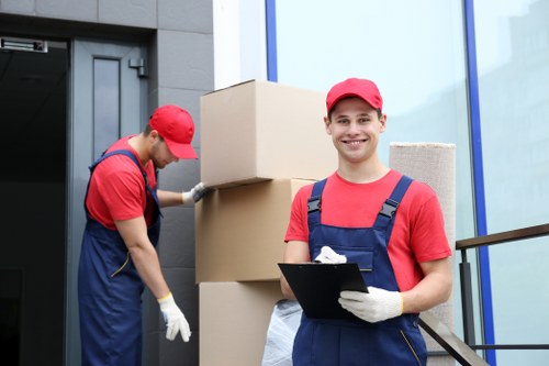 Removal team planning a safe move with boxes and equipment